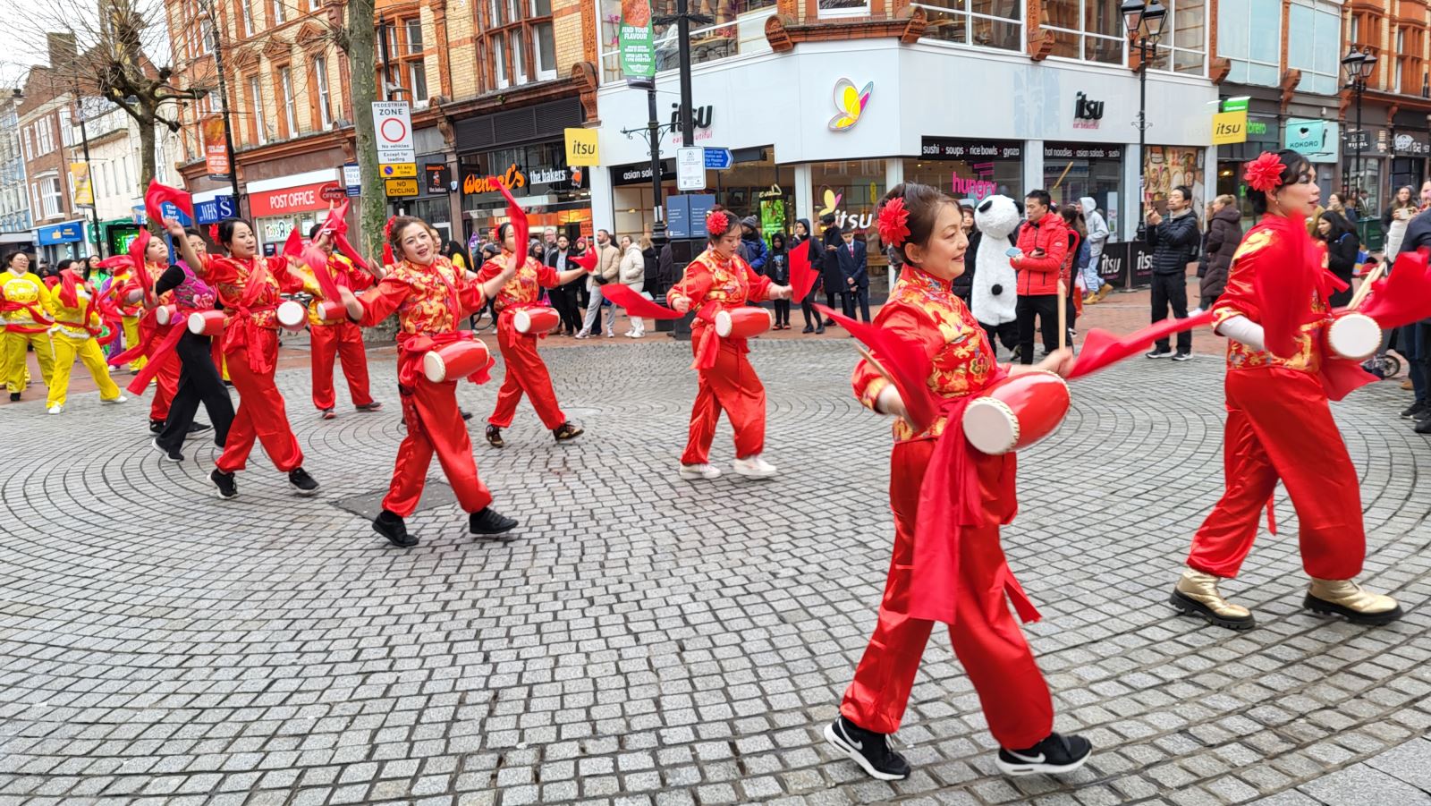 Lunar New Year performance - performers dressed in red